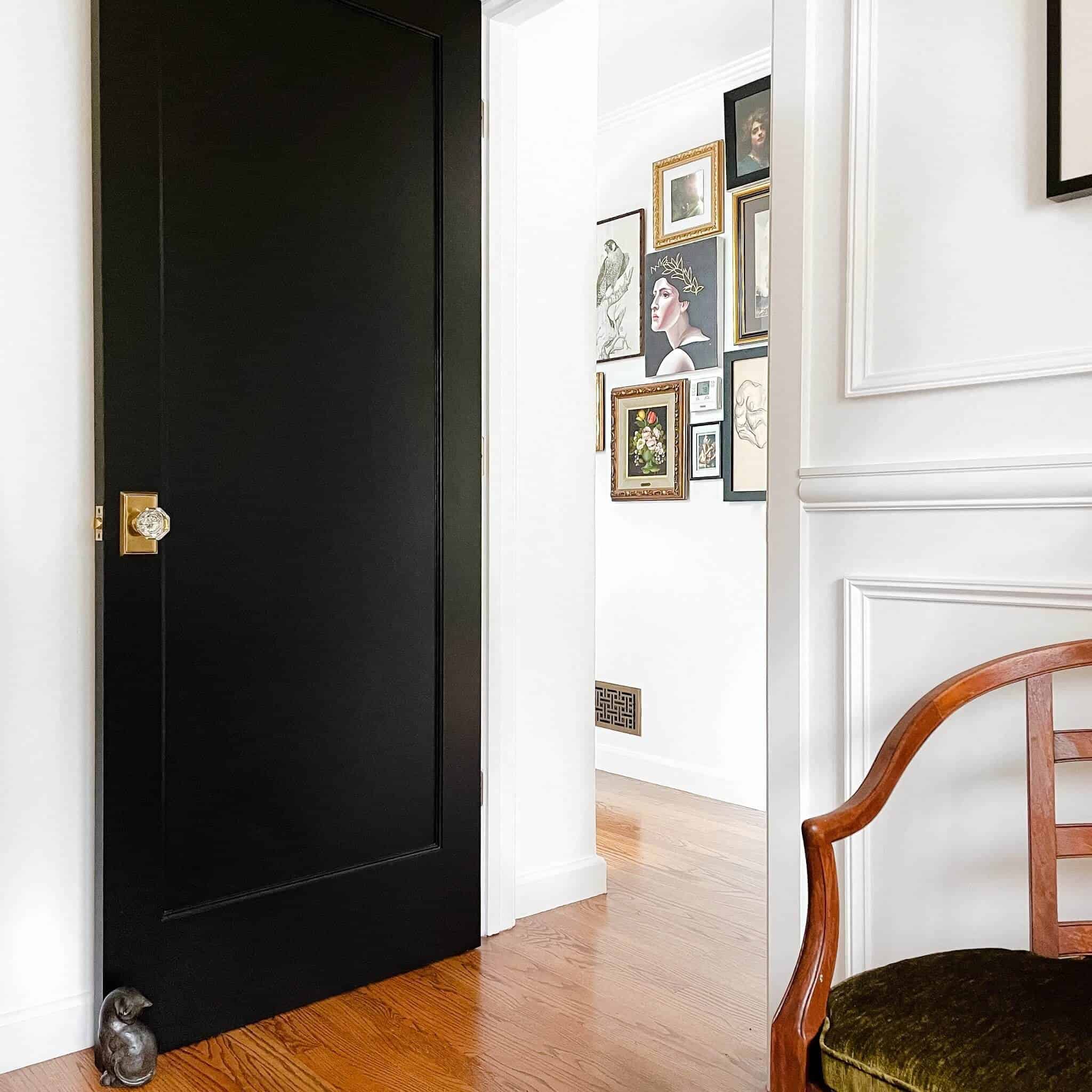 Black door with a brass handle.