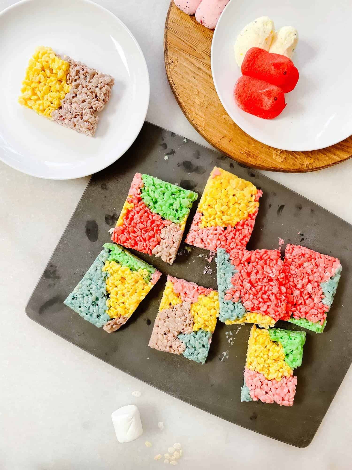Black board of colorful Peeps Rice Krispie Treats.