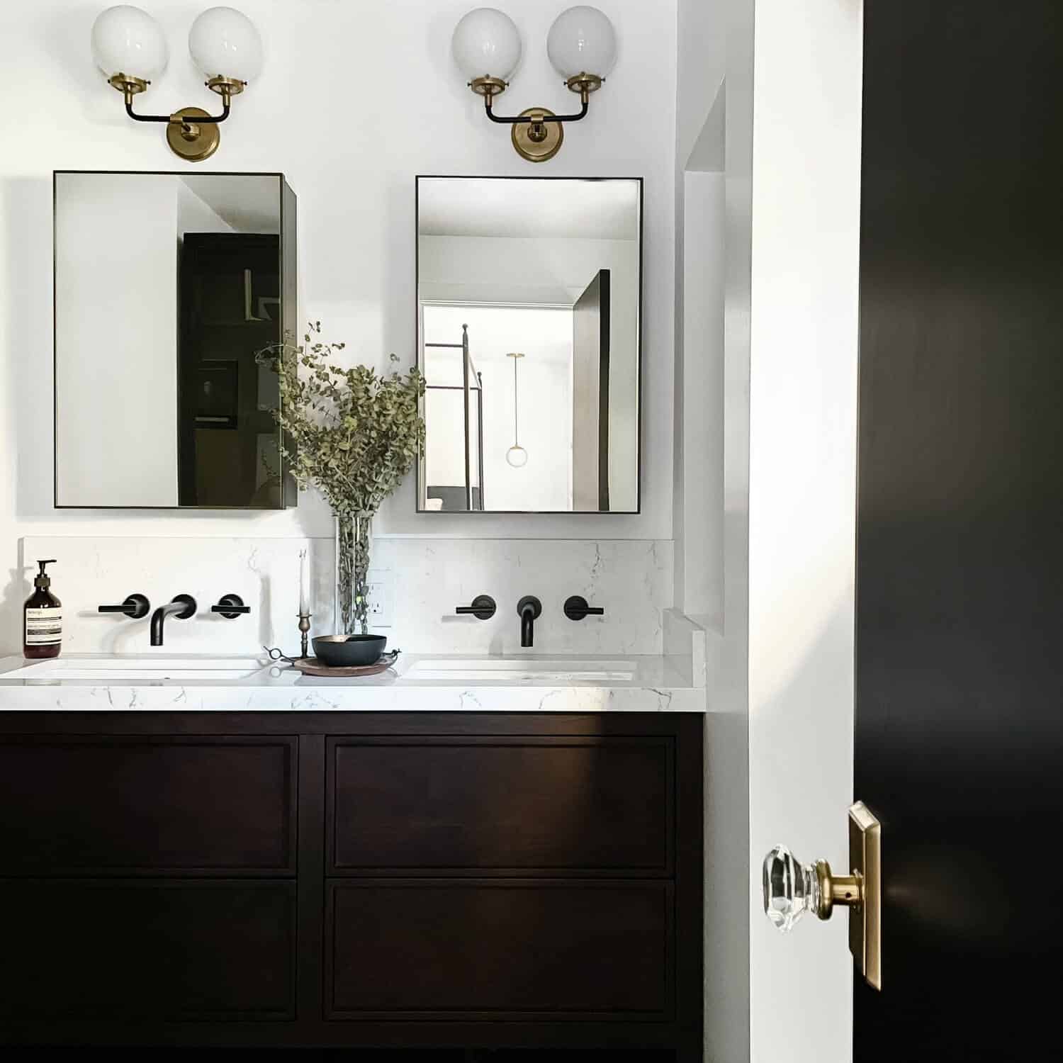 Bathroom with two mirrored medicine cabinets.
