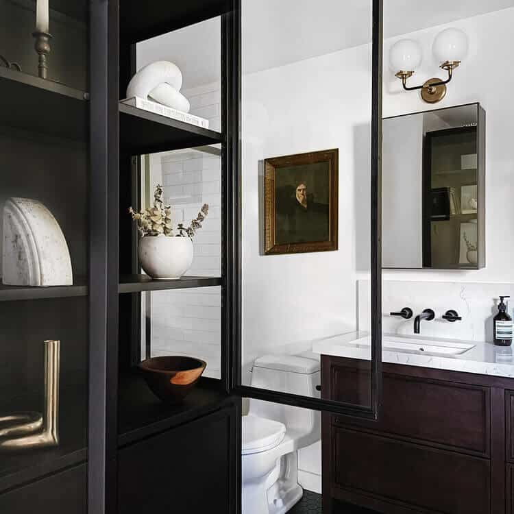 Bathroom cabinet with glass doors.