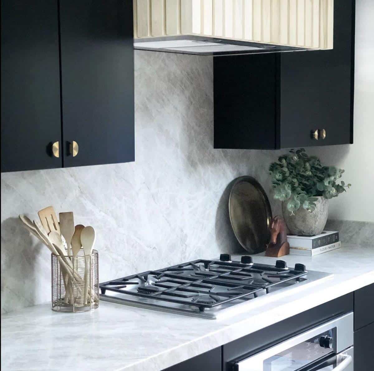 Black cabinets with half-moon handles.