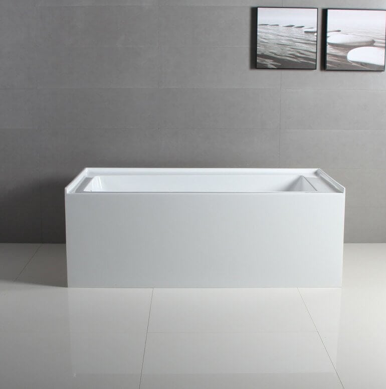 Freestanding rectangular white bathtub.
