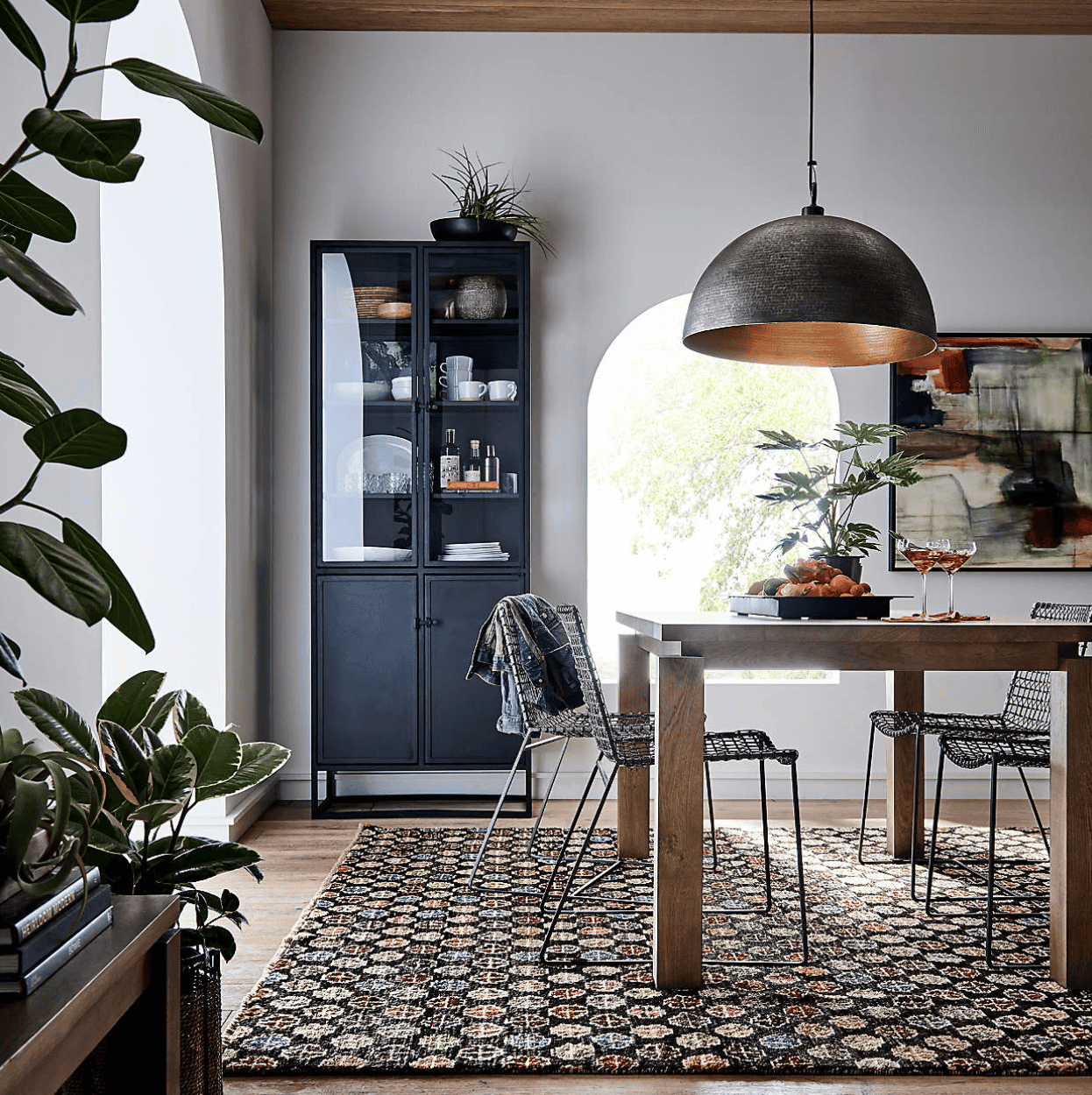 Dark cabinet in a room with light walls.