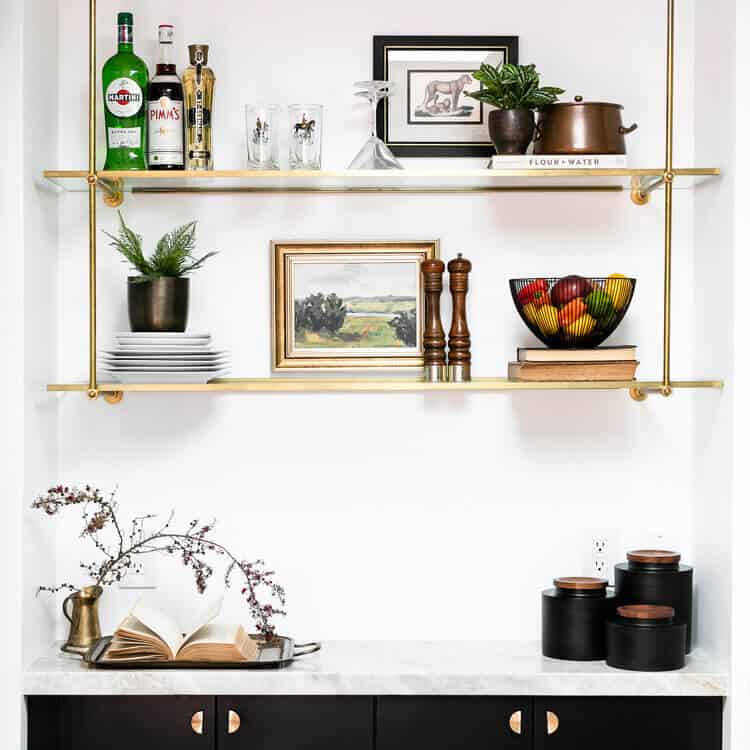 Bistro shelving filled with drinkware and decorations.