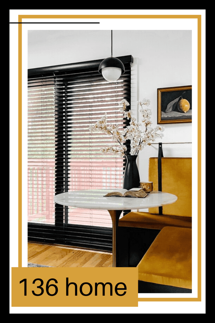 Blinds on a window next to a banquette with text \"136 home.\"