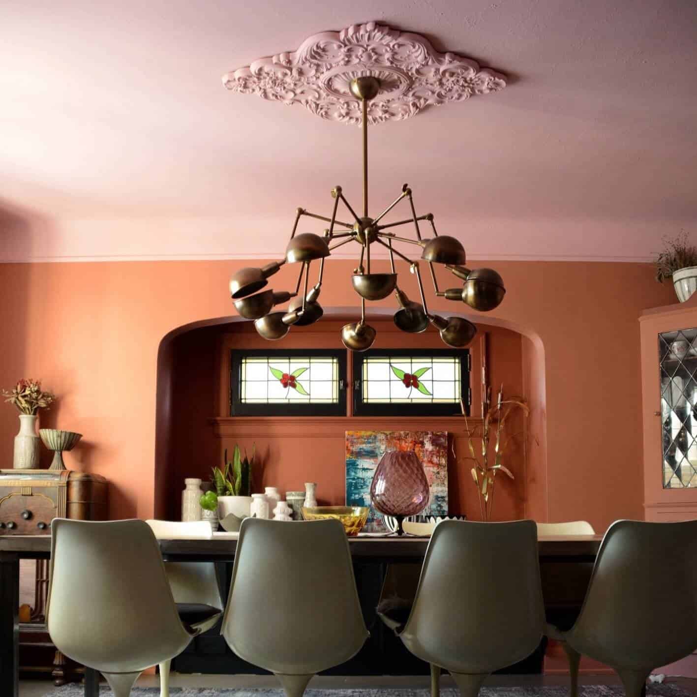 Room with orange walls and a pink ceiling.