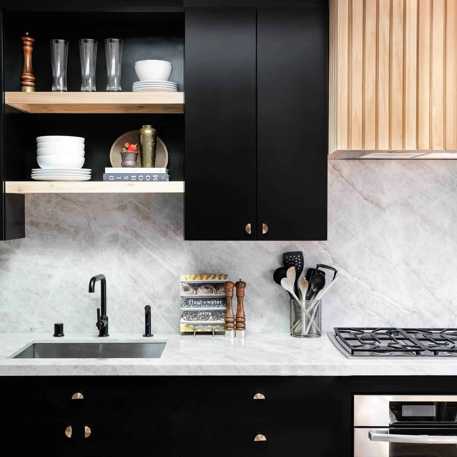 taj mahal quartzite counters with black cabinets