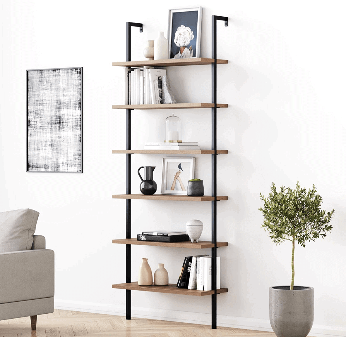Ladder shelf filled with books and decorations.