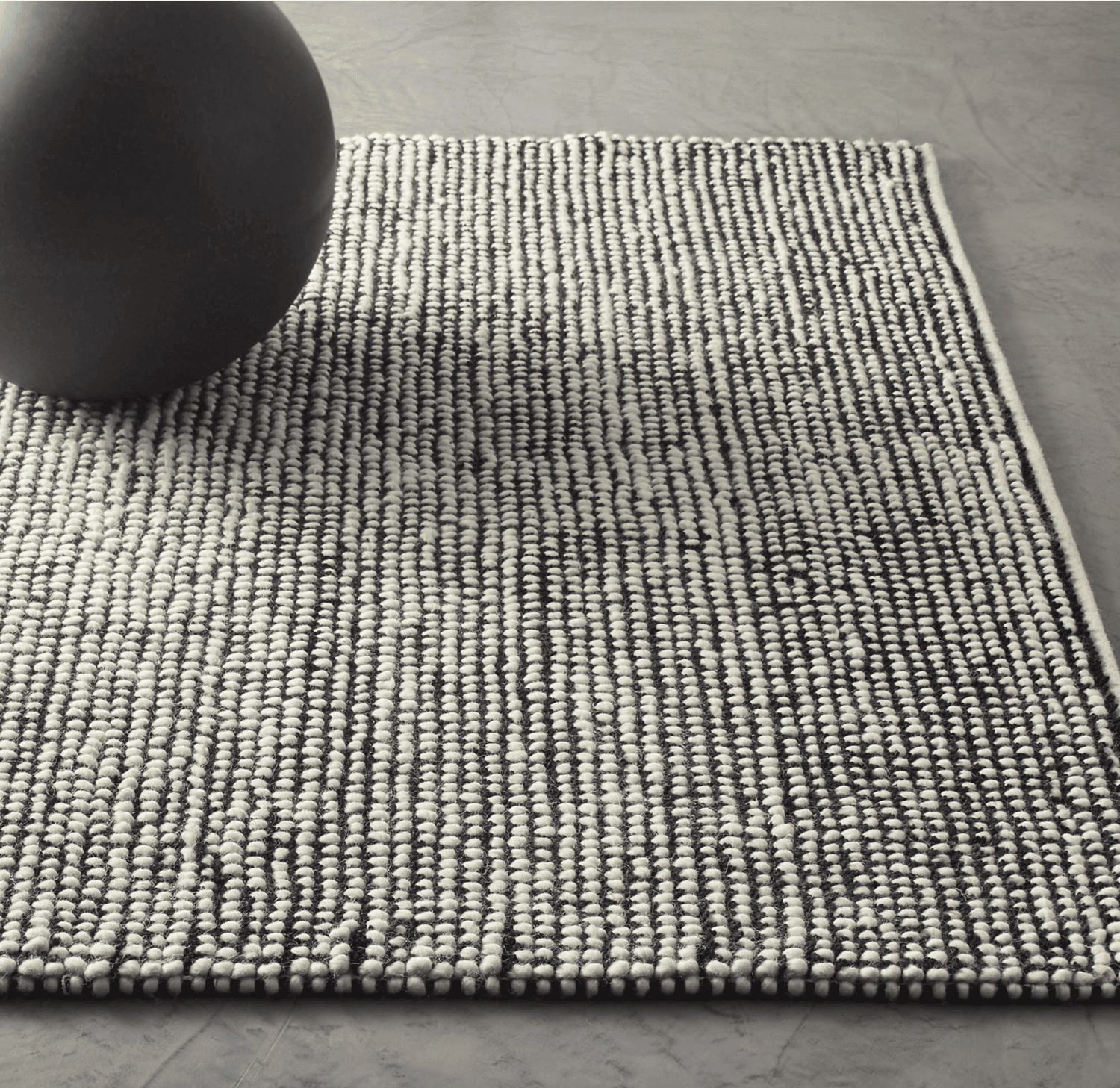 Black and white loop rug.