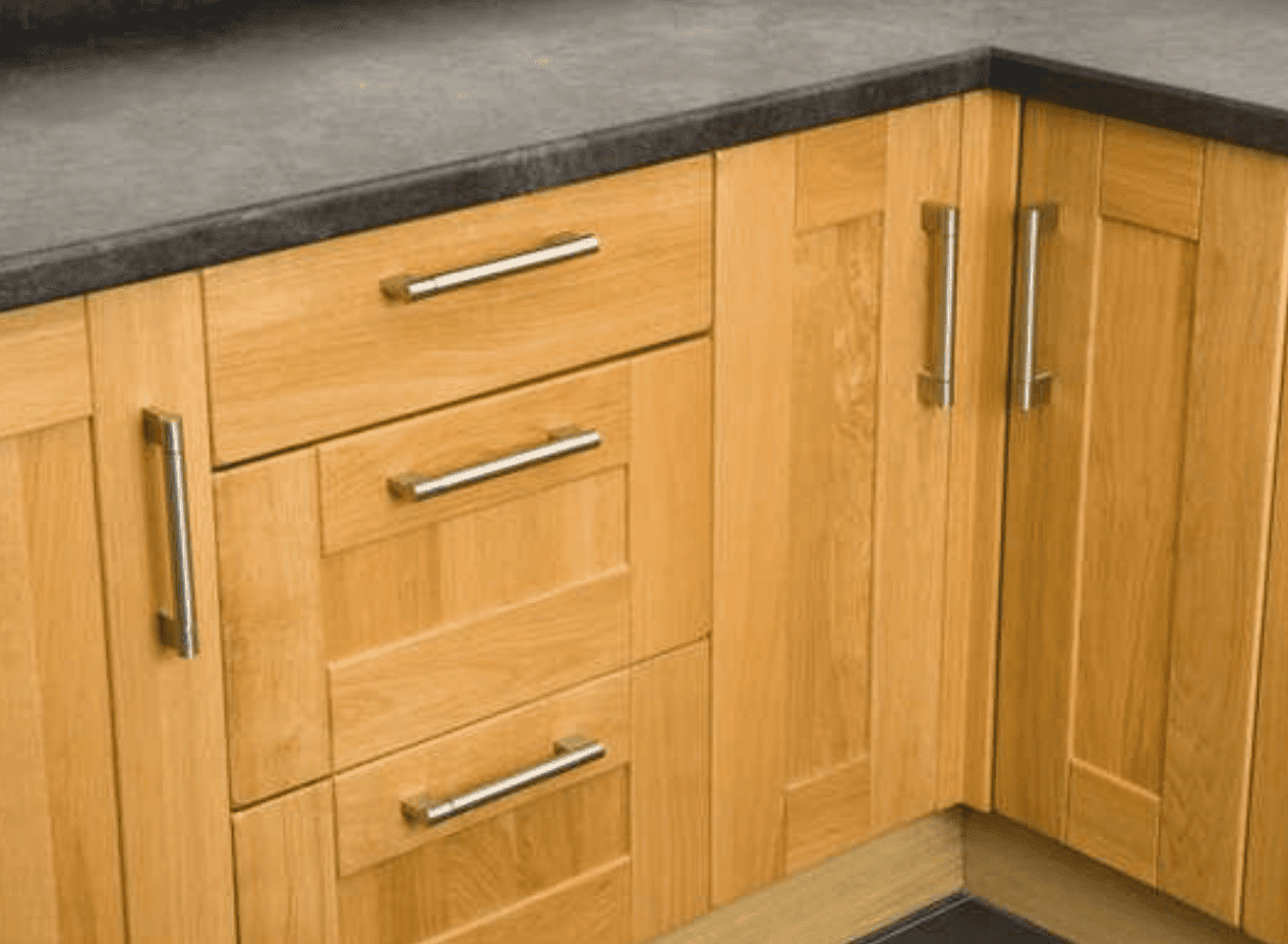 Simple handles on wooden cabinets.