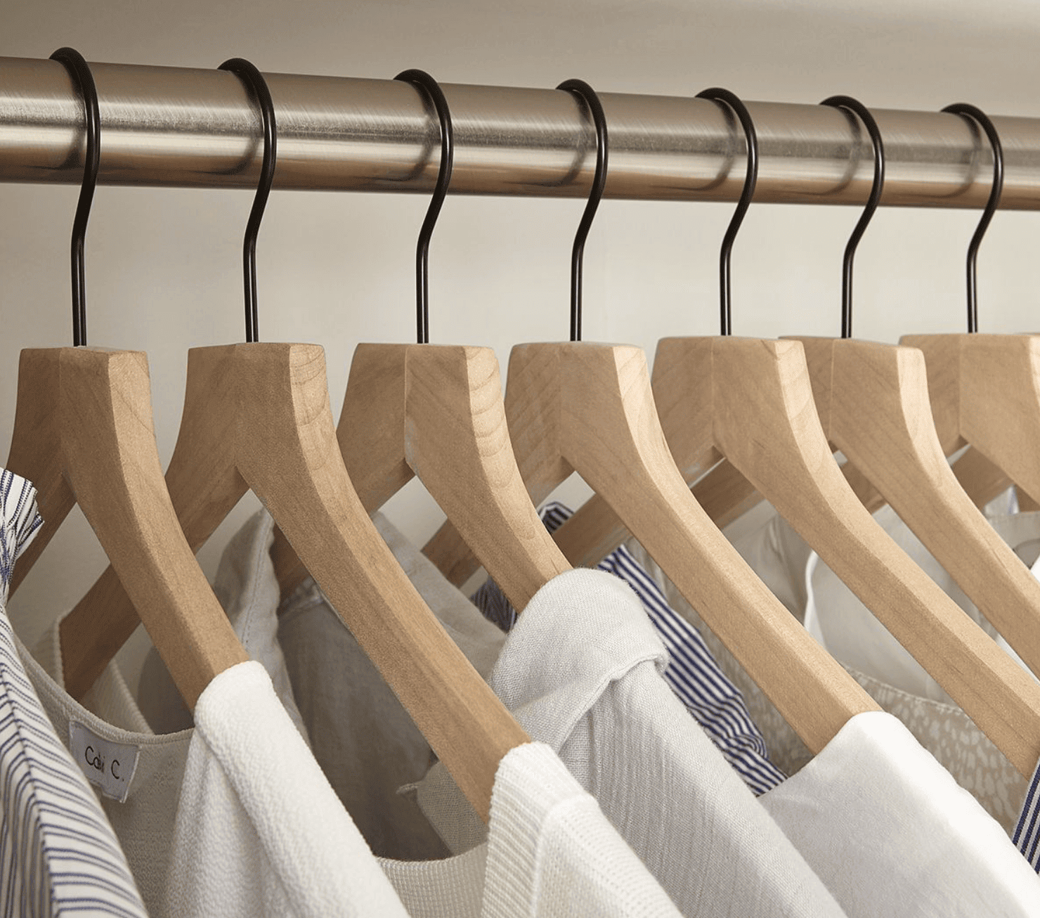 Clothes hanging on matching hangers. 