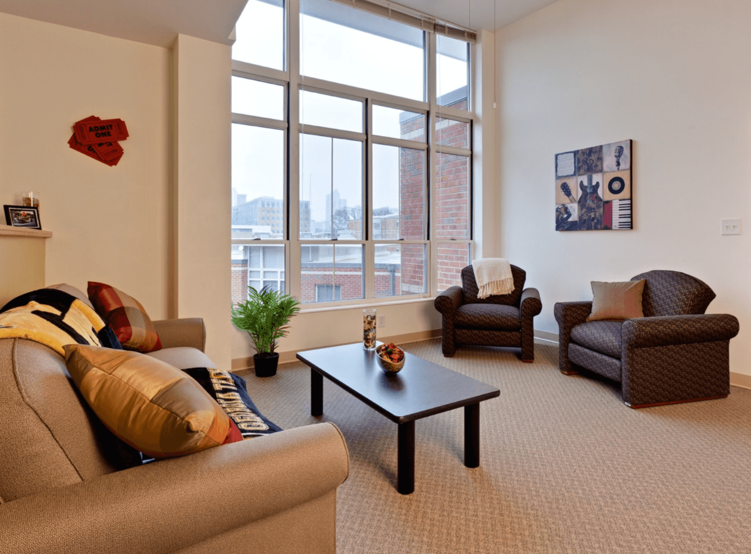 Small coffee table in a large room with furniture.