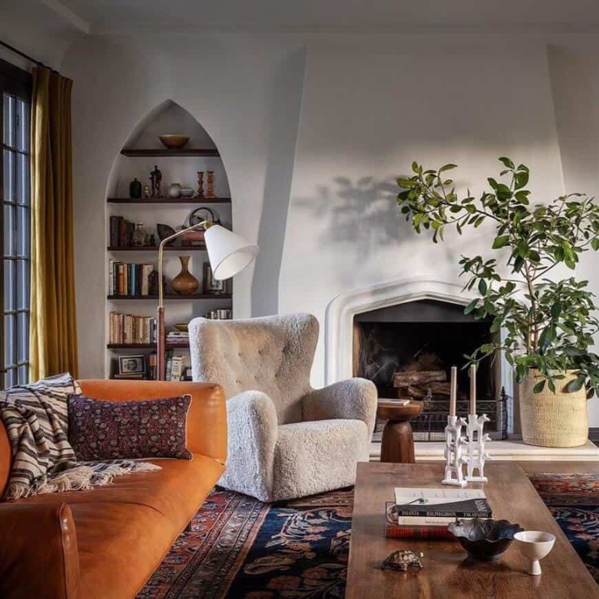 Orange sofa in a room with white walls.