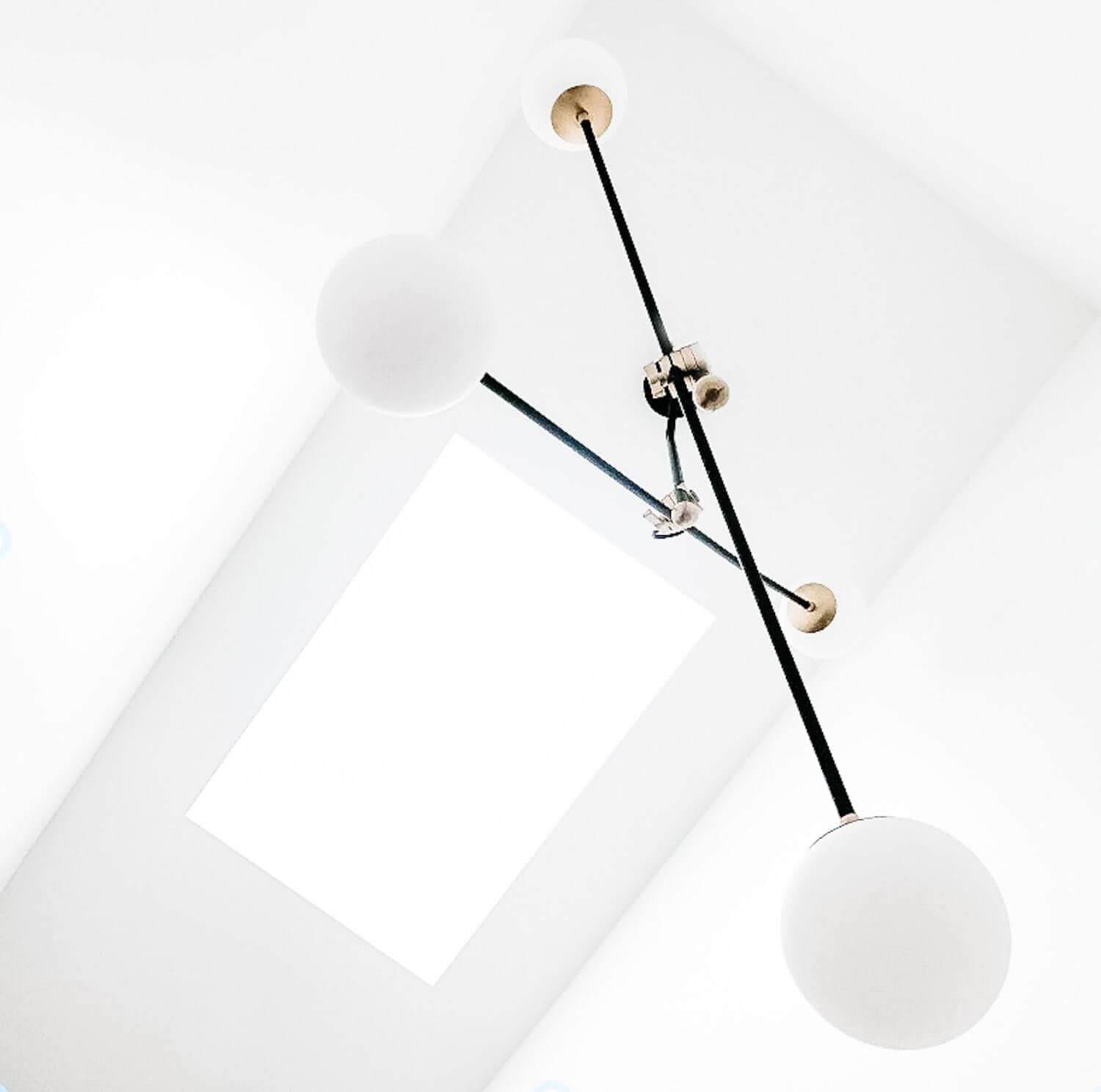Modern chandelier hanging from the ceiling.