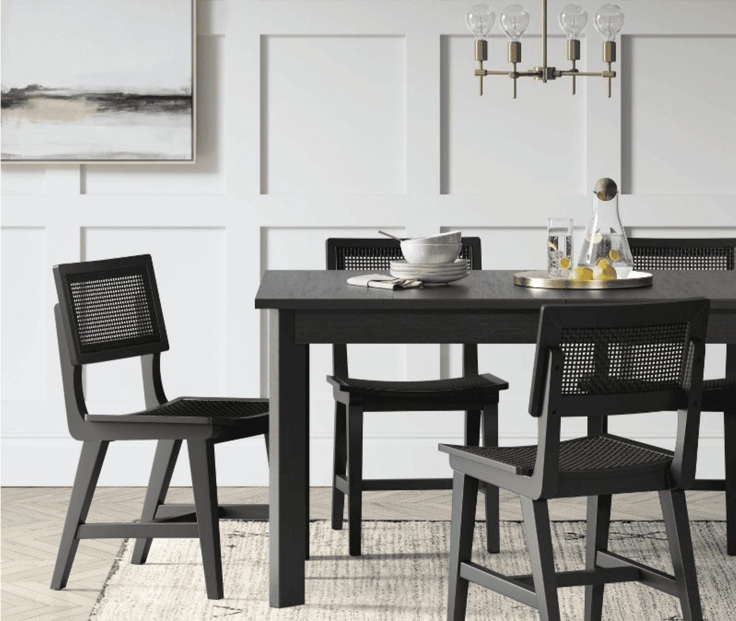 Black chairs around a black table.