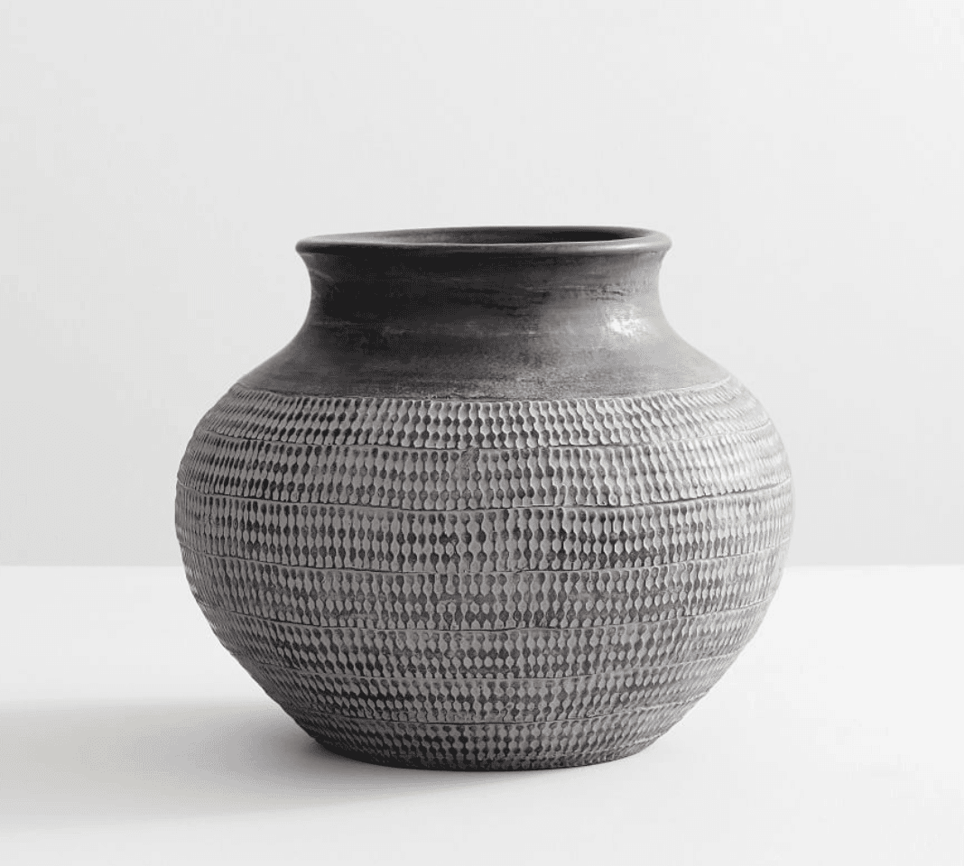 Vintage vessel in a white room.