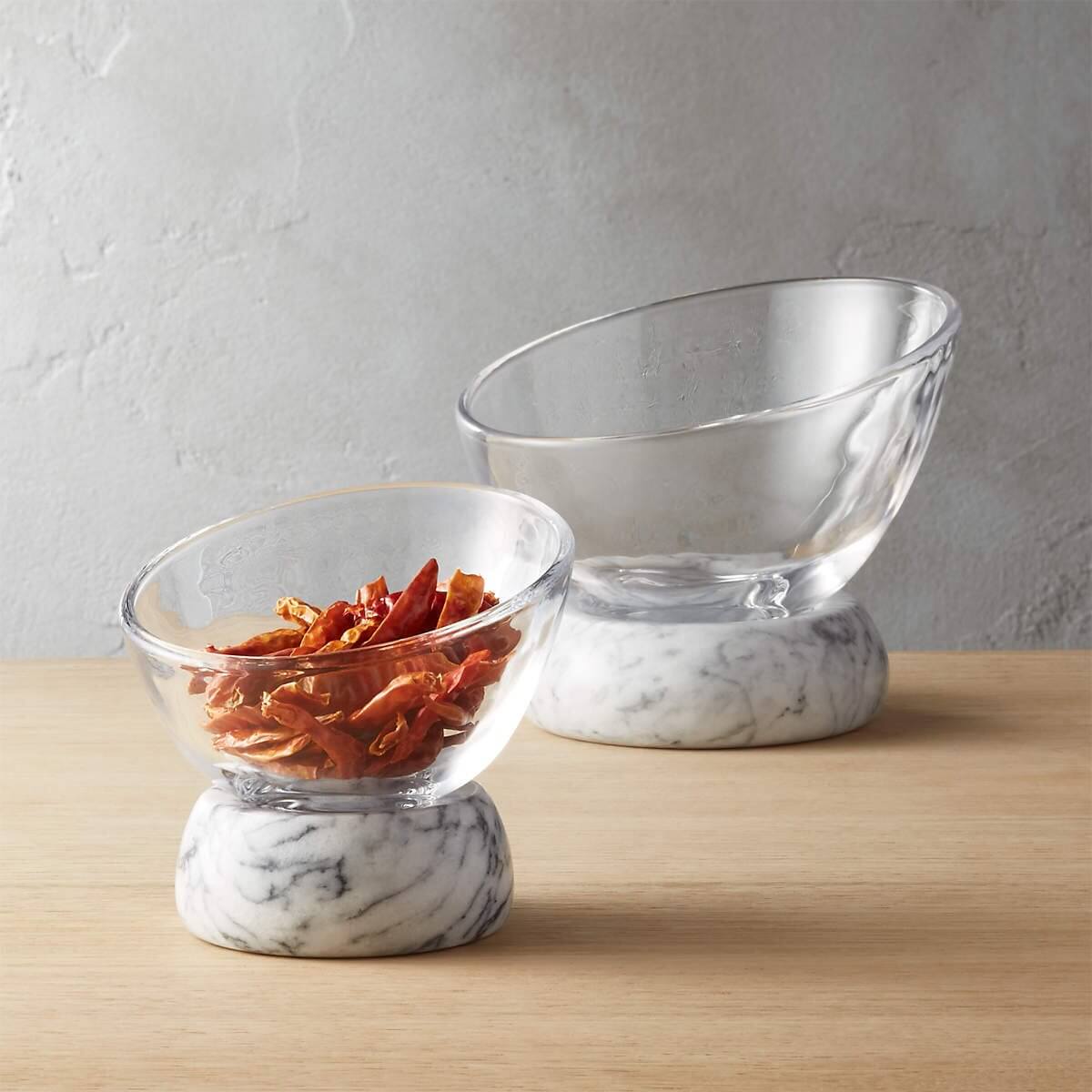 Two marble and glass bowls.