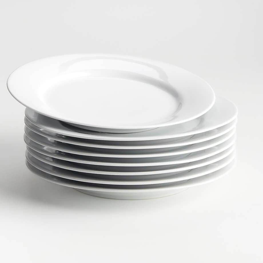 Stack of eight rimmed plates.