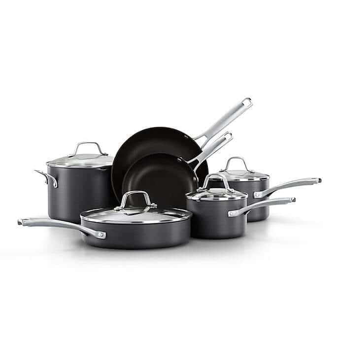 Set of black Calphalon pots and pans.