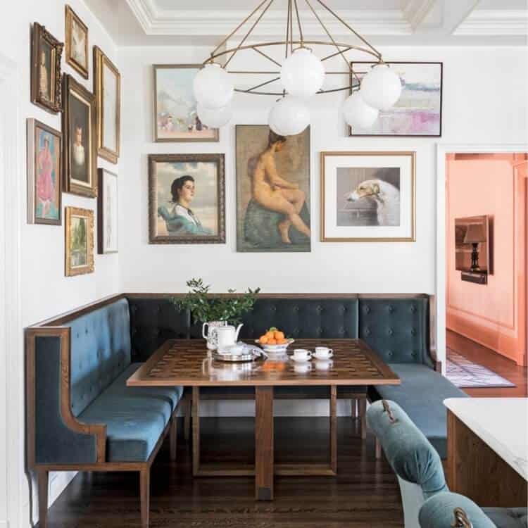 Benched seating area under a gallery wall.