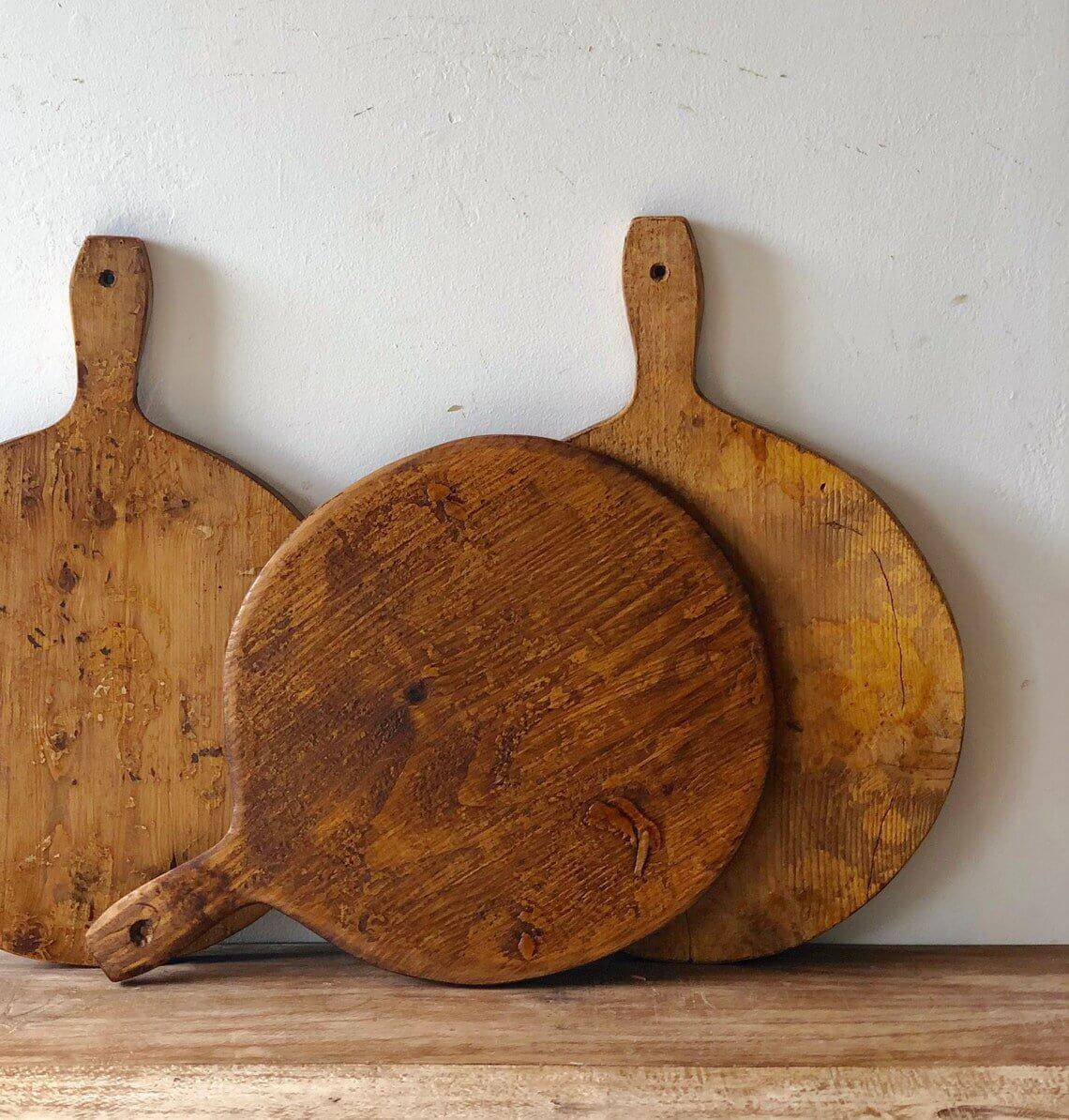 Three wooden bread boards.