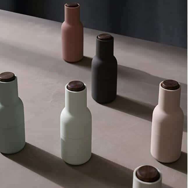 Several pastel salt and pepper grinders.