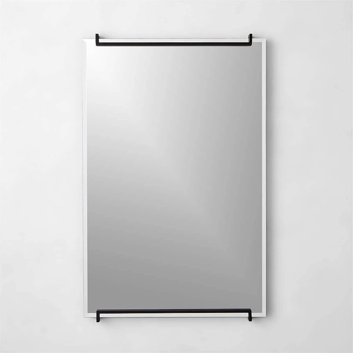 Mirror with a minimalist black frame.