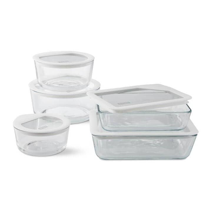Set of five Pyrex glass containers.