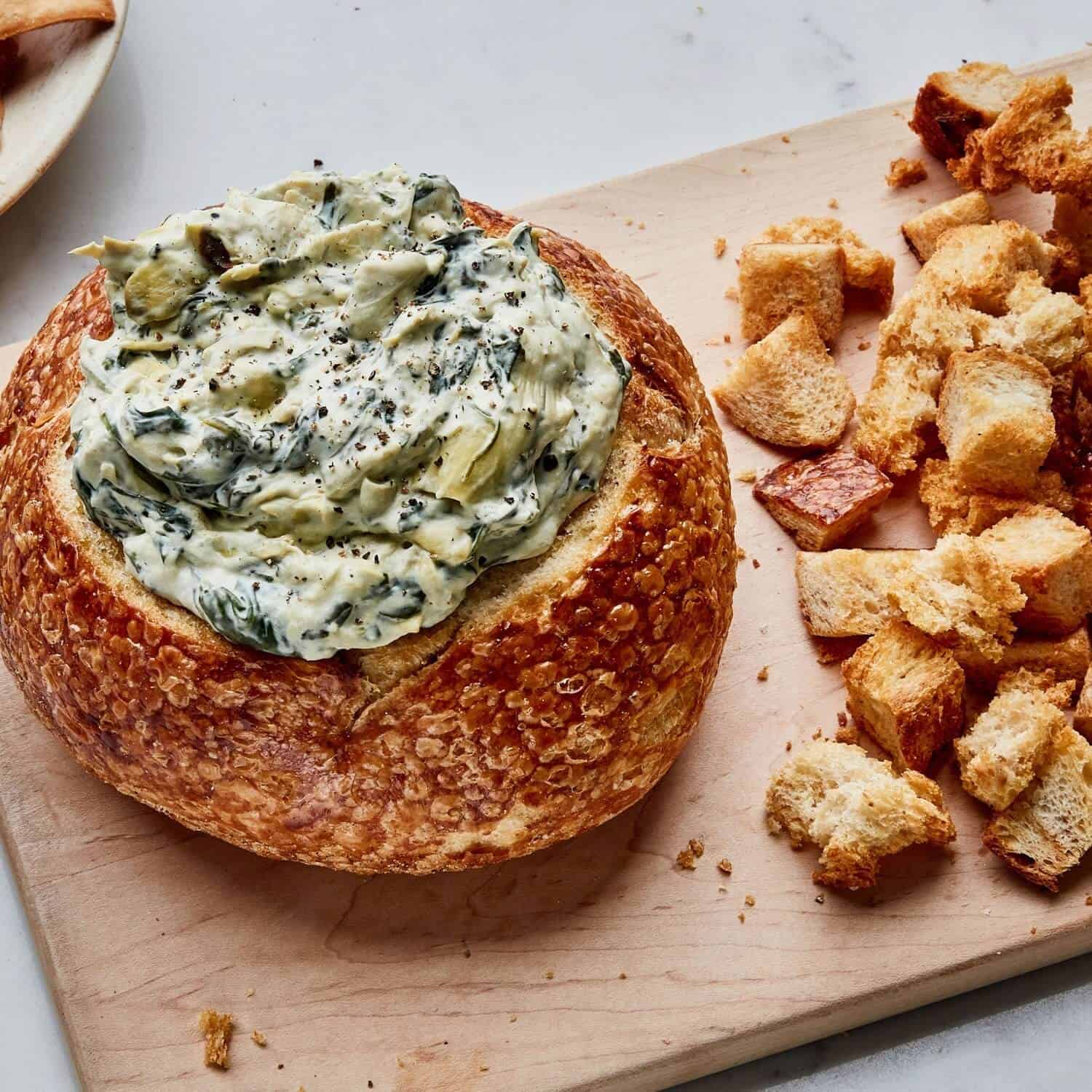 Spinach dip in a bread bowl.