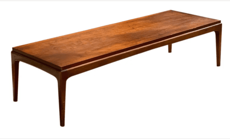 Rectangular wooden table on a white surface.