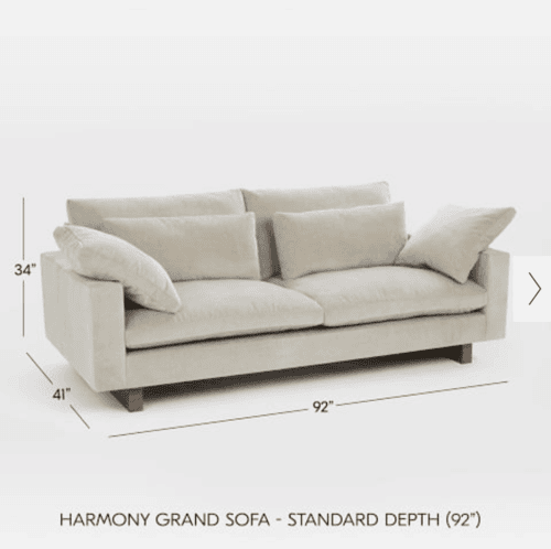 White sofa with dimensions on a white surface.