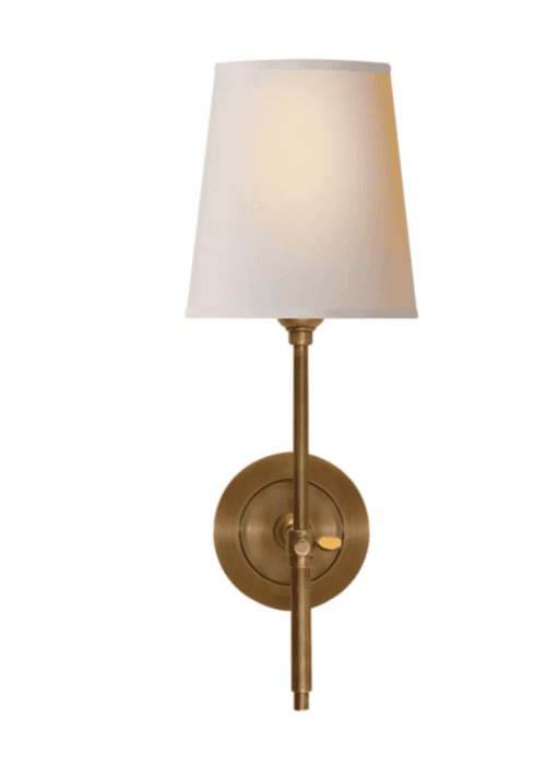 Wall sconce on a white surface.