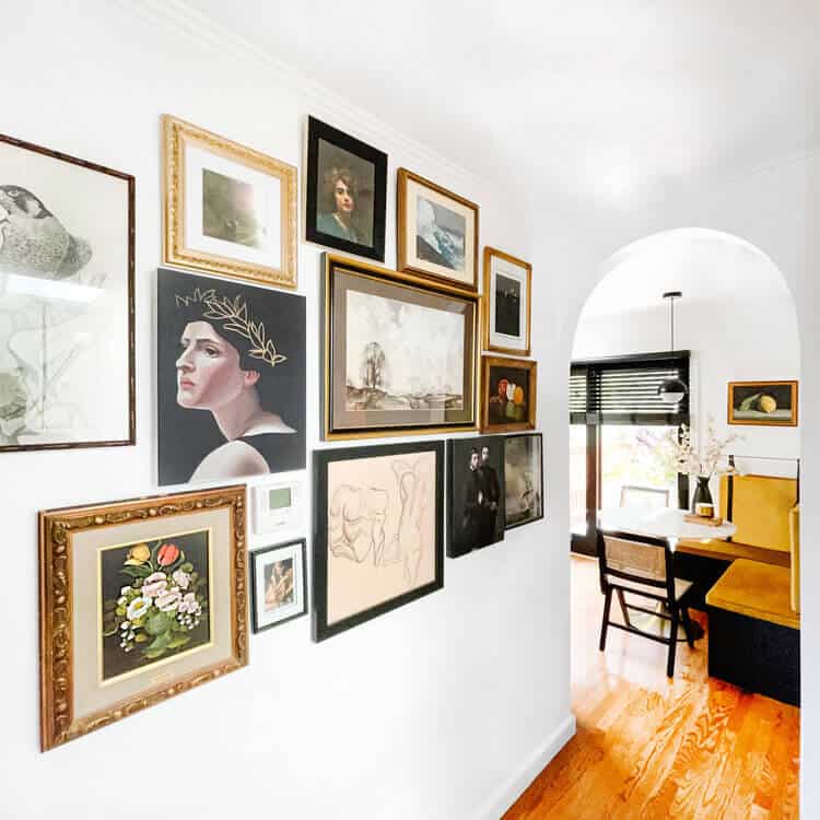 White hallway filled with art.