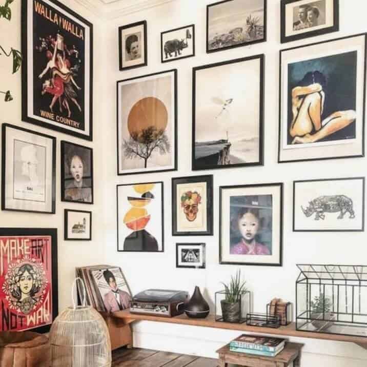 Colorful gallery wall over a record player.