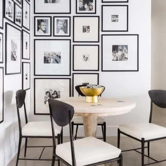 White walls filled with black and white art.