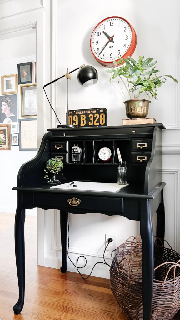 A room that has a clock on a table office desk decoration ideas