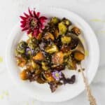 Air Fryer Brussel Sprouts with Soy Sauce and Honey on a white plate.