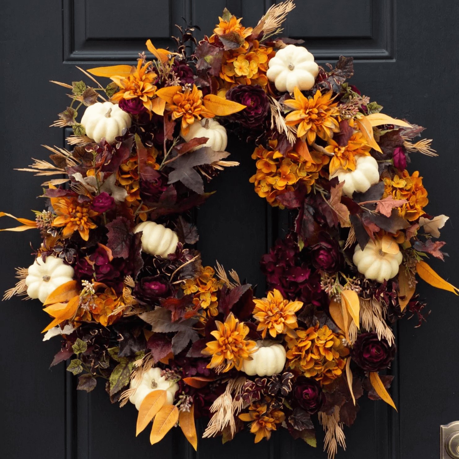 Fall wreath with white pumpkins.