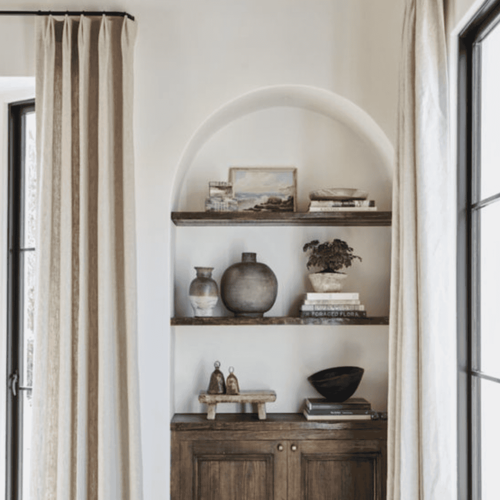 Arched bookcase with walnut wood shelving