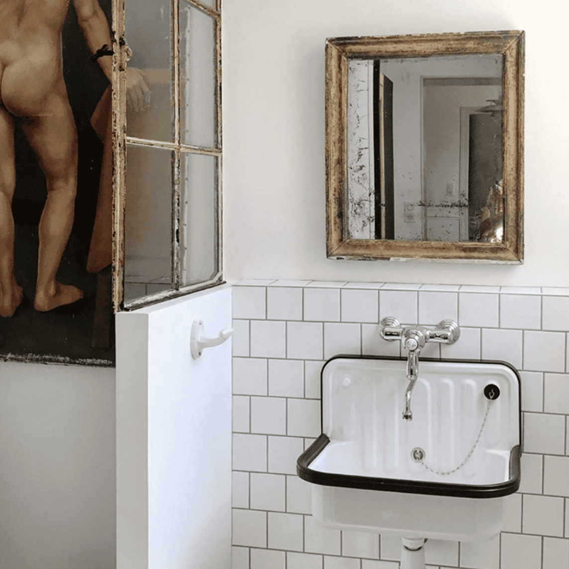 White and black sink on white tile.