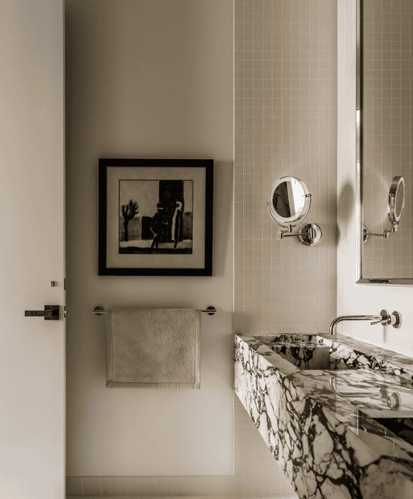 Bathroom with black and white quartz countertop.