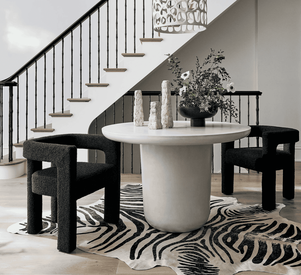 White table on a zebra rug.