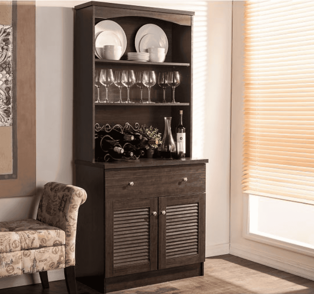 Kitchen hutch cabinet filled with dinnerware and glassware.