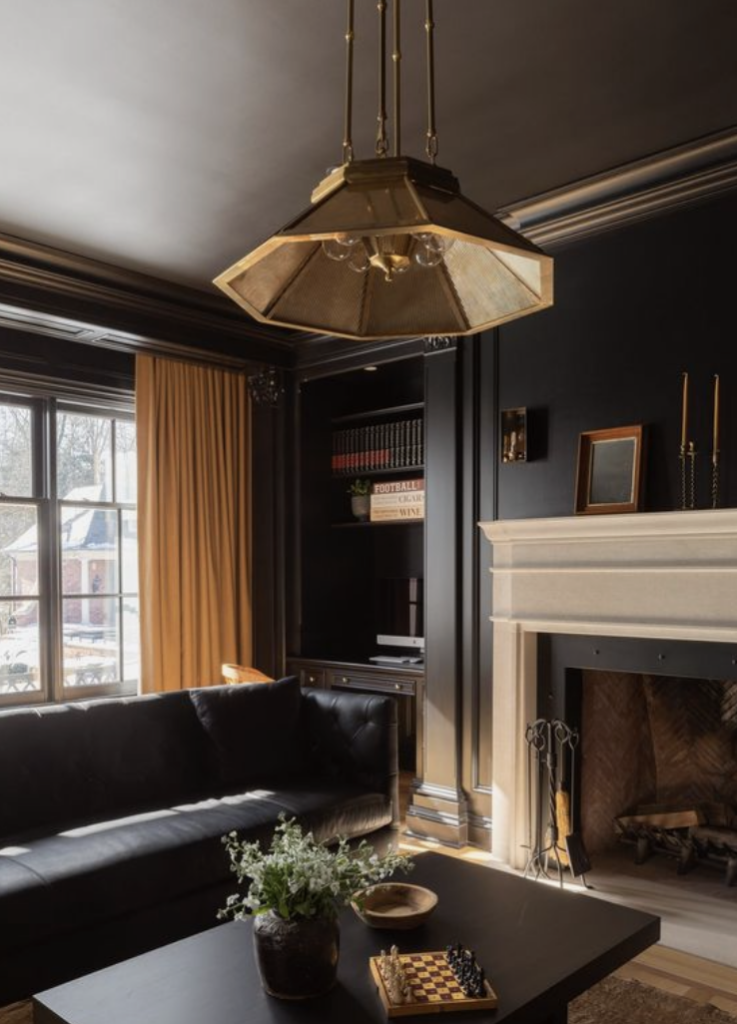 dark moody space for how to how to decorate a living room with a fireplace