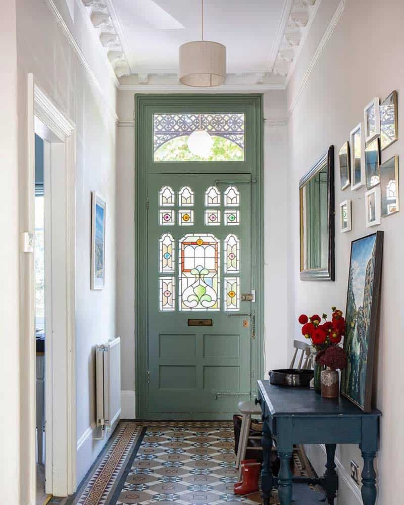 Indoor view of a front door with stained glass.