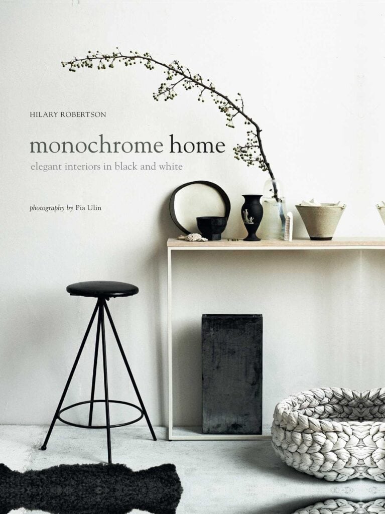 Book titled \"monochrome home elegant interiors in black and white.\"
