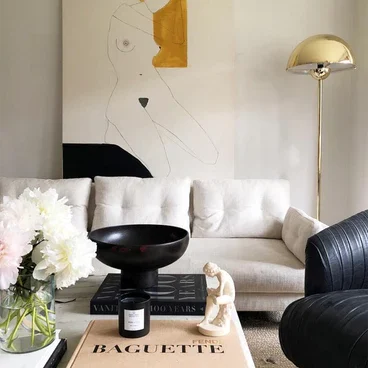 Bright living room with white and black accents.