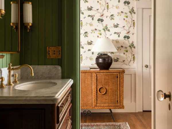 easy bathroom upgrades include green wainscoating, wallpaper, vintage rugs, and restore hardware with new sconces.