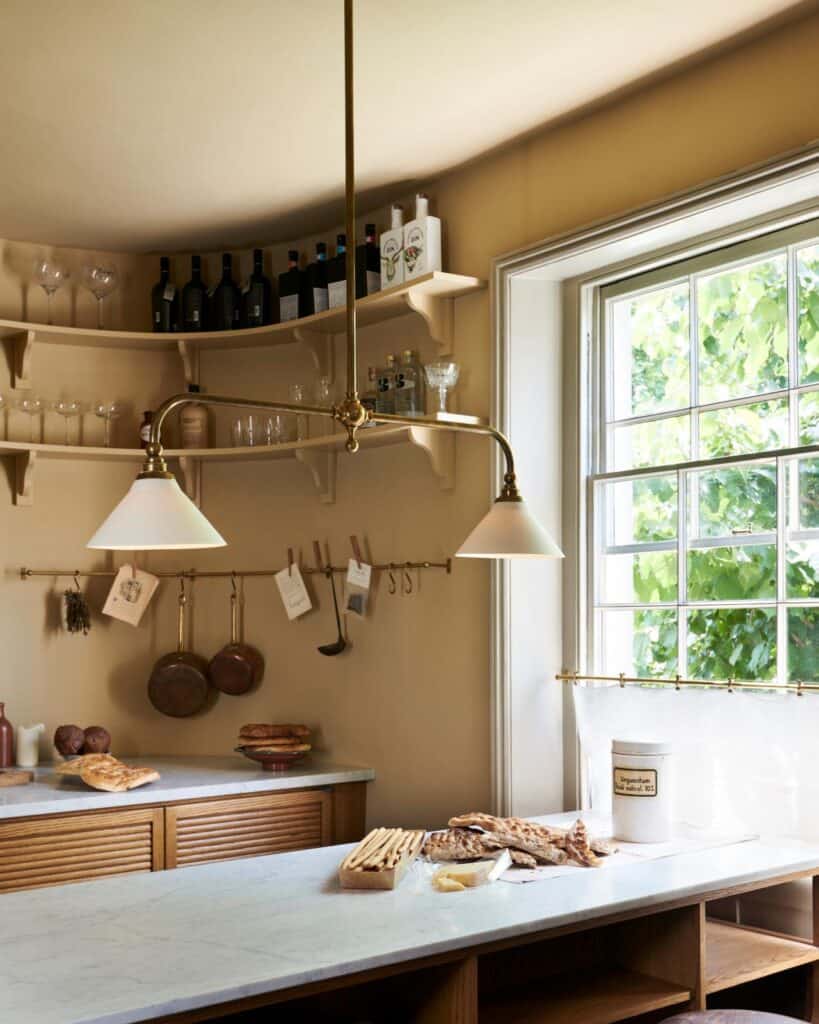 how to decorate kitchen walls with brass pot rail