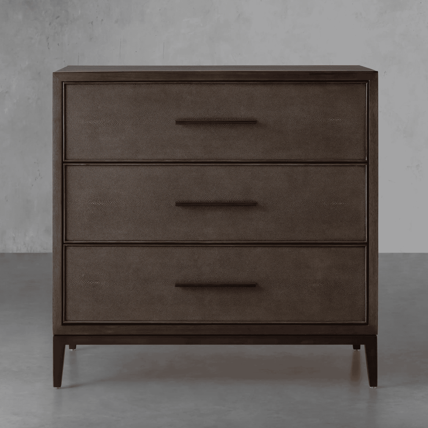 Dark, wood, three-drawer dresser.
